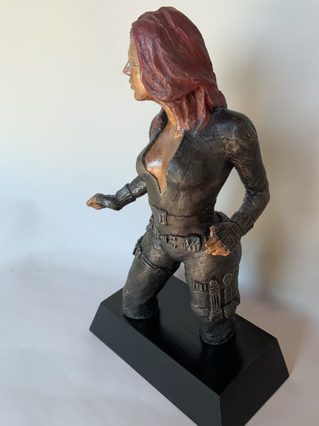 Stoneware Sculpture  Superhero Black Widow in skintight leather jumpsuit stands in readiness to kick ass