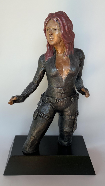 Stoneware Sculpture  Superhero Black Widow in skintight leather jumpsuit stands in readiness to kick ass 